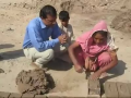 A Woman Making Bricks For Family Help And Income Raising