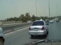 SMS Fever: Man Texts on Hood of Speeding Car!